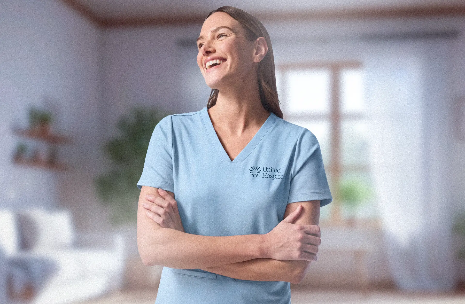 A United Hospice nurse in uniform, smiling